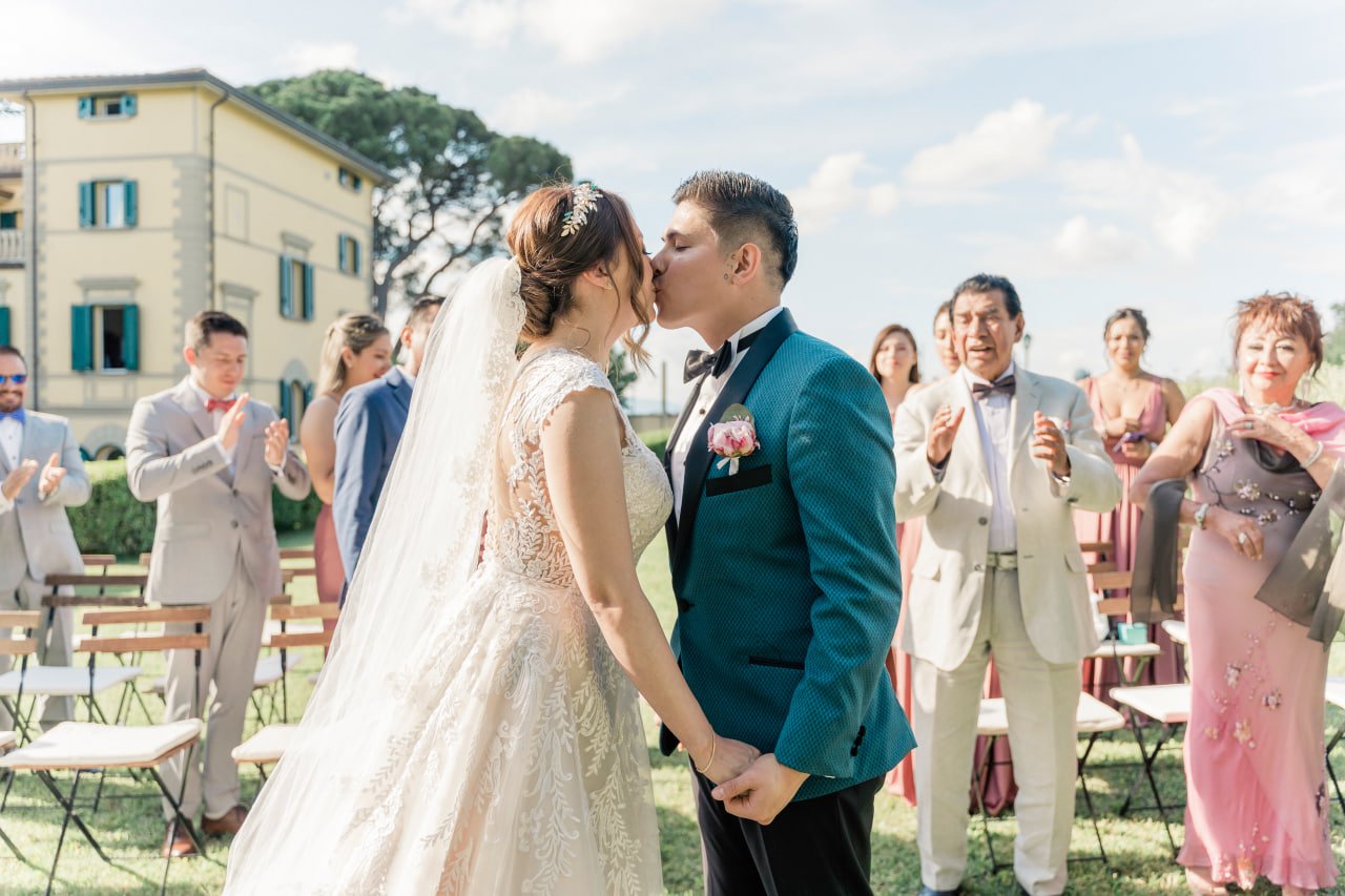 bride and groom first kiss