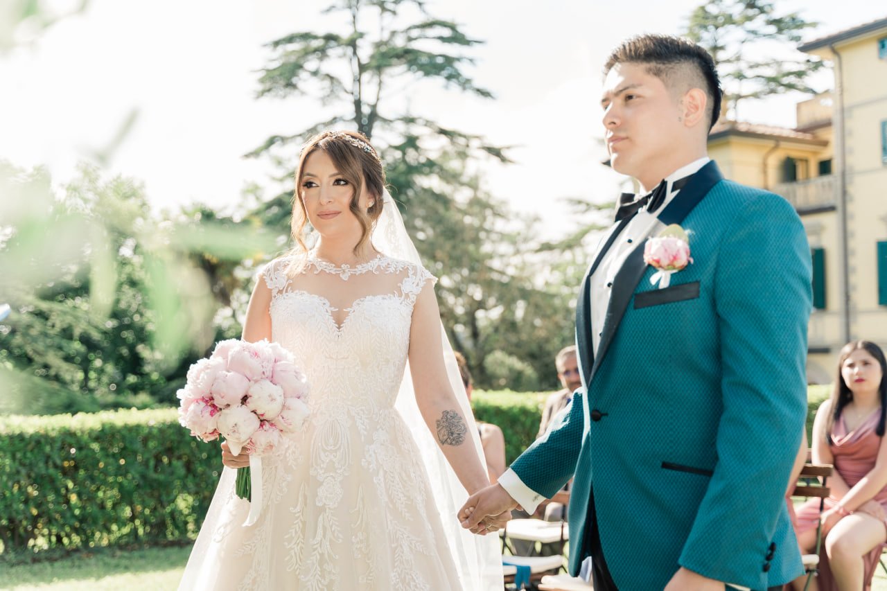 bride and groom holding hands